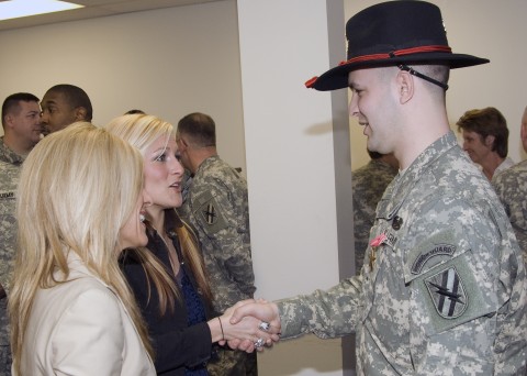SPC Lowe shakes hands with singer Brittini Black who sang the National 